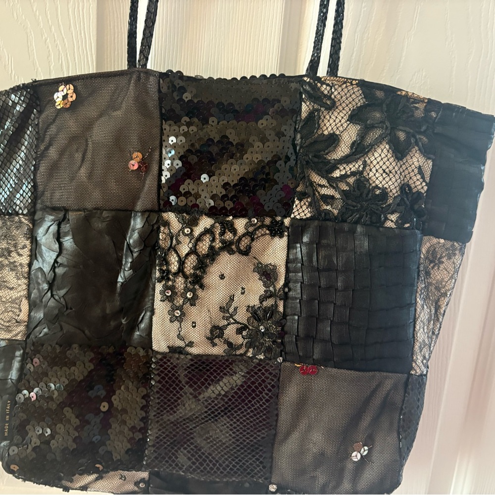 Handcrafted leather and fabric tote.